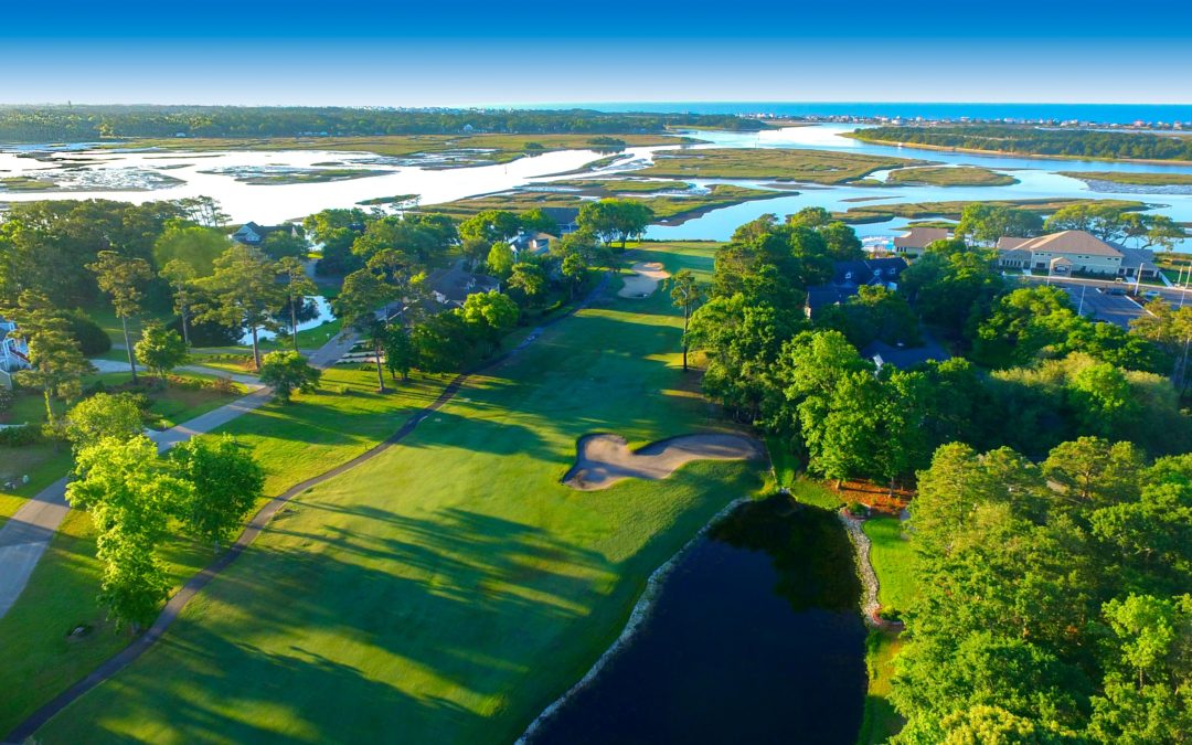 Aerial view of coastal golf course and marshes